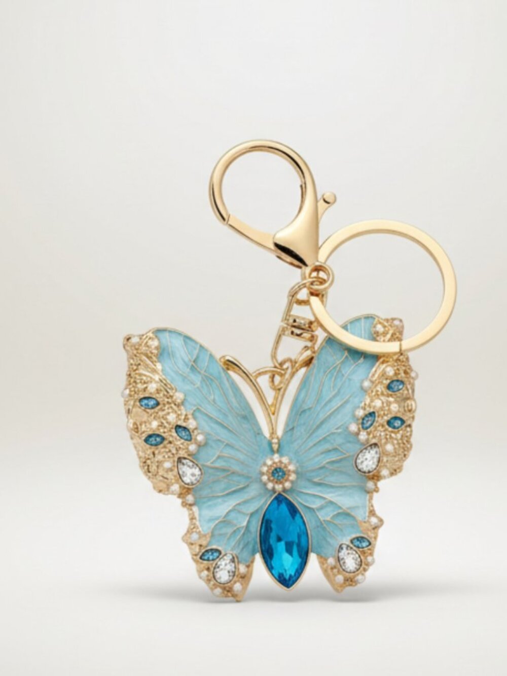Bling Butterfly Rhinestone Keychain/Charm/Brooch.  Brand new. Light Blue.
